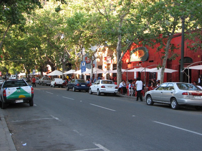 IMG_5733.jpg - Bellavista street scene. Afternoon brings in people who sit outside under the canopies to pass this time of day.