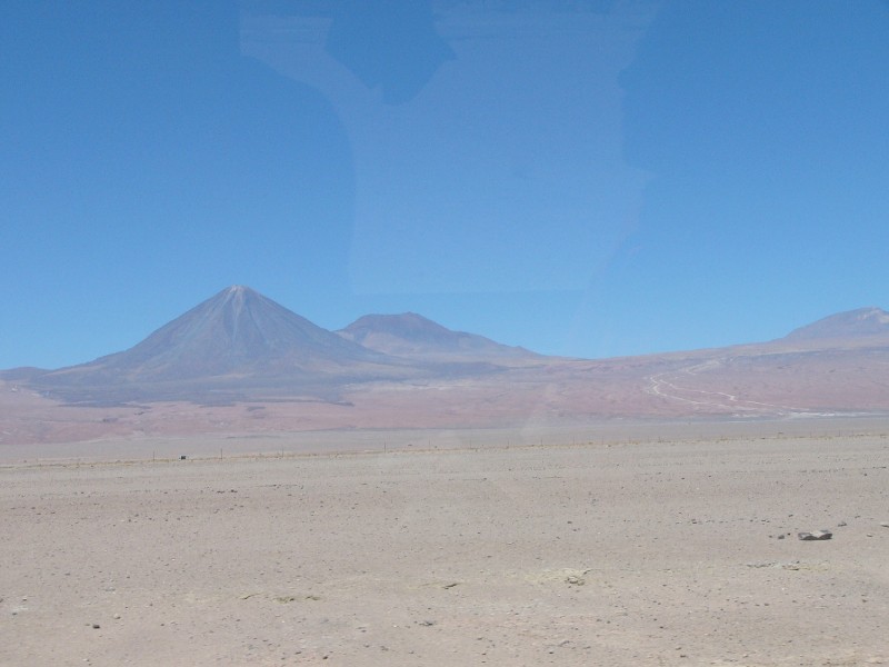 P1080349.JPG - How can we ignore Volcan Licancabur? To the right is the desert road out of Chile and into Bolivia/Argentina.
