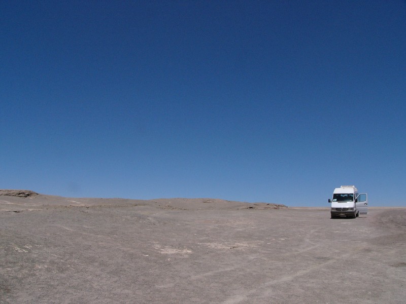 P1080429.JPG - Our tour bus stopped at Laguna Chiu Chiu standing all alone in the desert landscape.