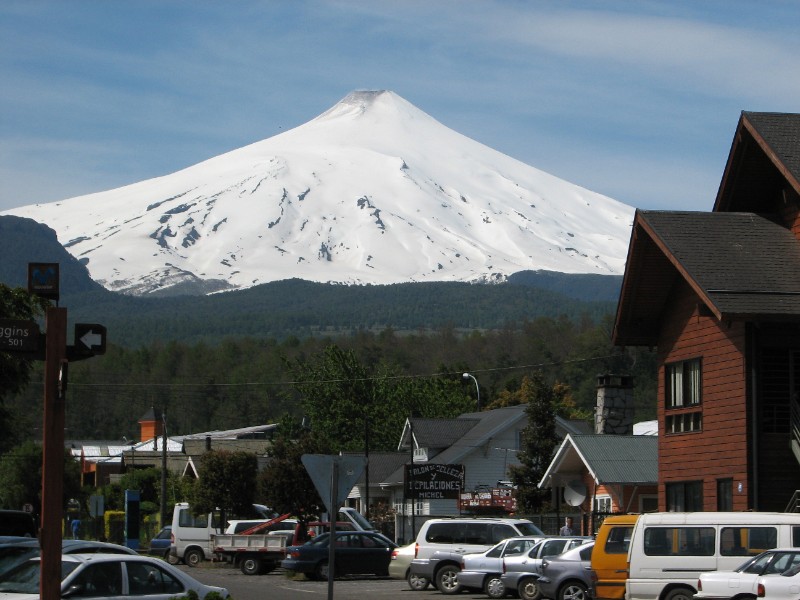 IMG_5760.jpg - Pucon with the smoking Volcan Villarica at an altitude of 2,847 m (9,338 ft) above sea level in the background. Of course, the risk of an eruption always exists for this touristy town.