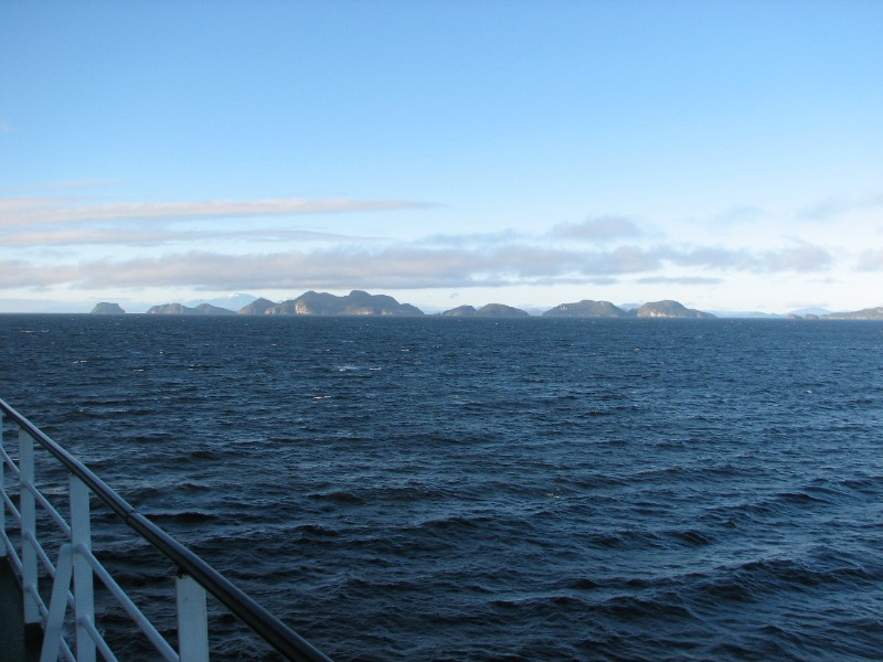 IMG_5950.JPG - Day 2: 6:40 am. After passing through the wide gaps of the Gulf of Ancud and the Gulf of Corcovado, the route enters the narrow channels of the Chilean fjords. This is the Moraleda Channel.