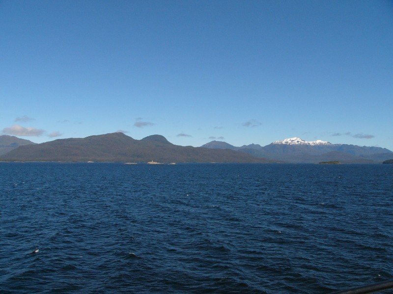 P1080809.JPG - Day 2: 9:45 am: After passing through the wide gaps of the Gulf of Ancud and the Gulf of Corcovado, the route enters the narrow channels of the Chilean fjords.  This mountain is actually WEST of the ferry looking towards the archipelagos.