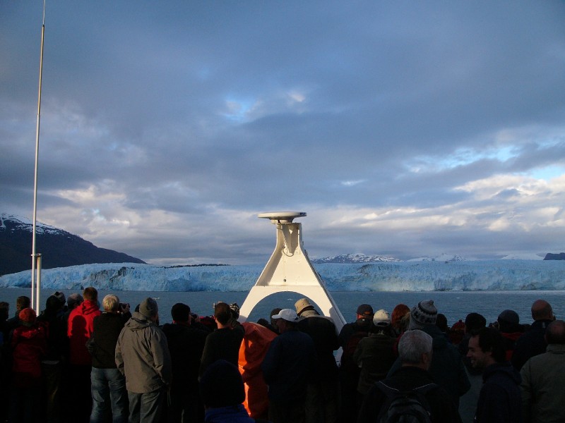 P1080899.JPG - Day 3: 7:30 pm: The cloud cover and the proximity of the Glacier made it very cold to be outside. Everyone is fully decked up on deck to enjoy the sight.