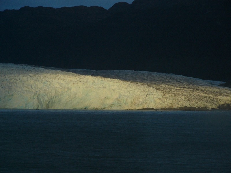 P1080906.JPG - Day 3: 7:45 pm: Parting shot of the Glacier suddenly lit by the sun as the ferry moved away.